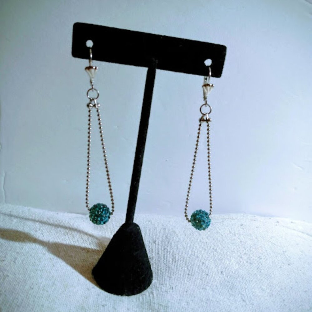 Turquoise color crystal drop pierced earrings.